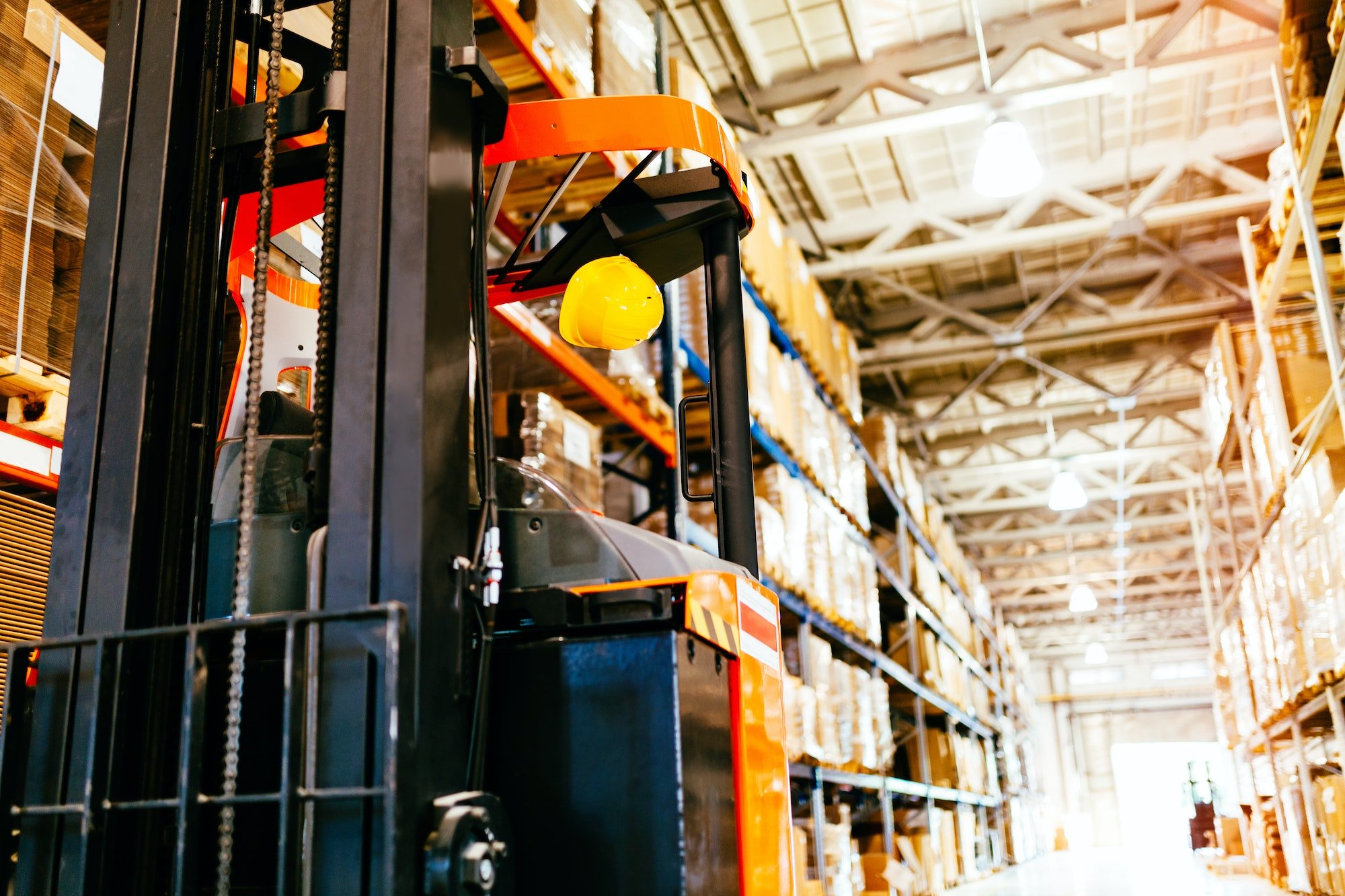 Picture of forklift machine parked in warehouse