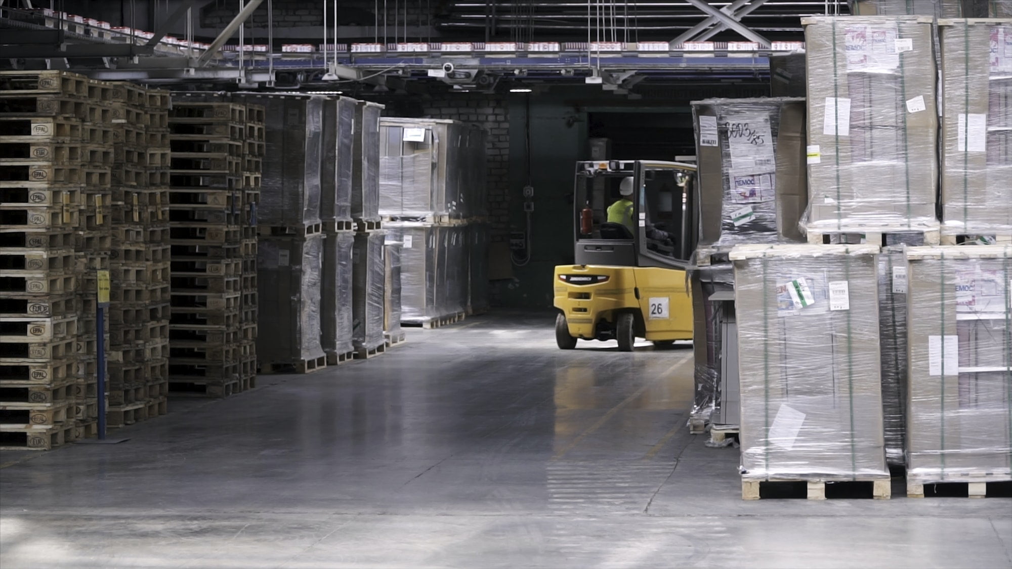 Fork lifter work in big warehouse. Clip. Warehouse man worker with forklift. Warehouse Rack of the