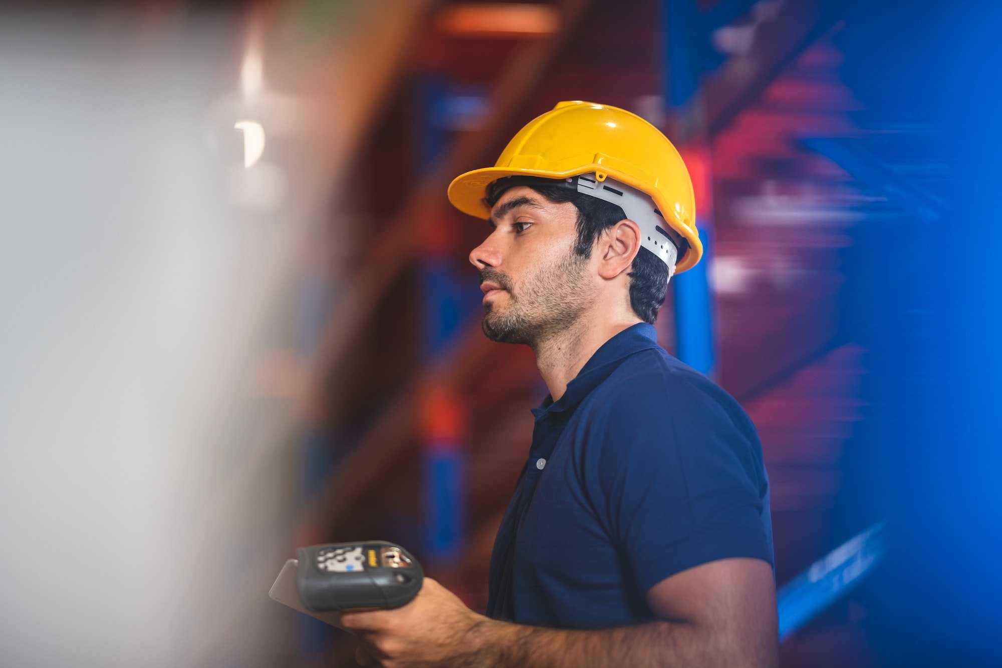 Male warehouse worker portrait in warehouse storage