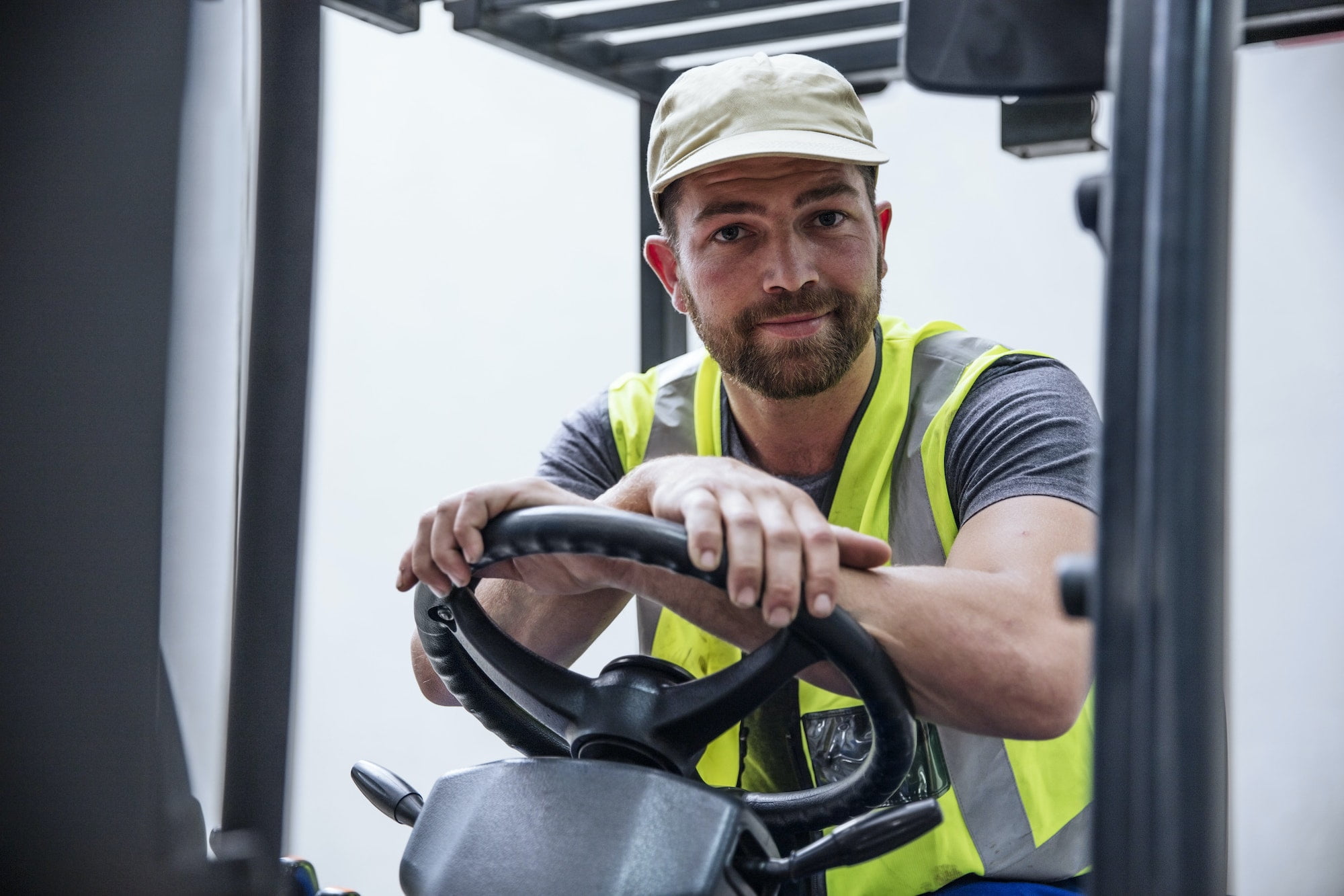 Portrait of confident man on forklift